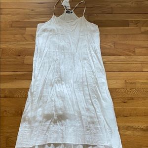 white flowy dress with detailing on top and bottom